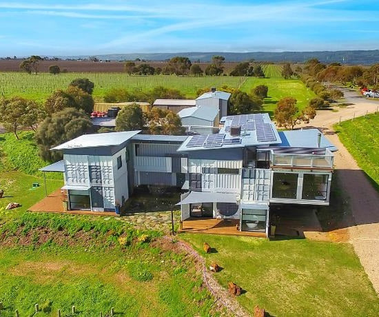 Modern house with solar panels in a rural setting