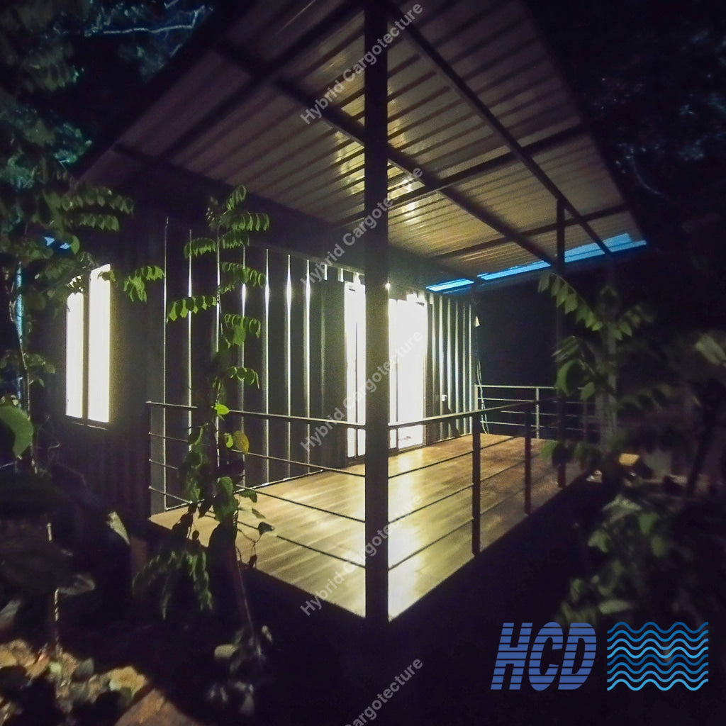 HCD 20ft Hybrid Chalet with covered deck at night in Hiriketiya
