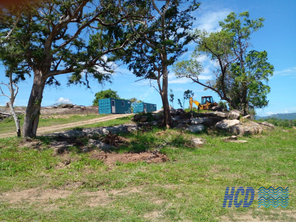 HCD container offices on a remote site with construction equipment