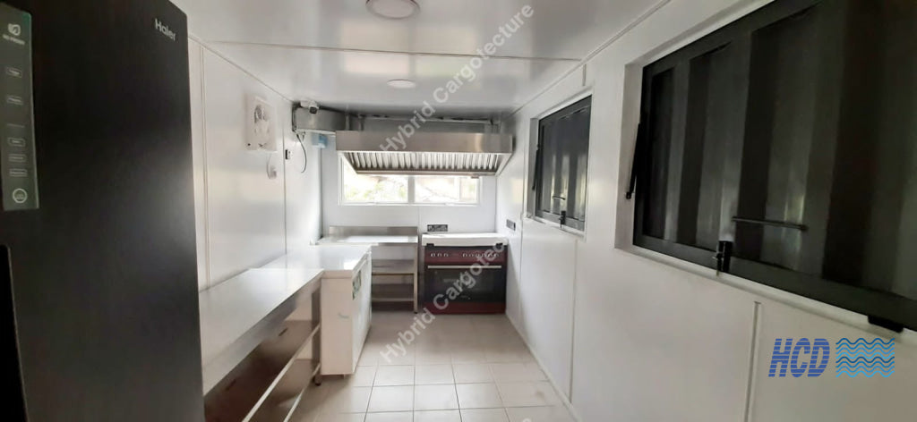 HCD Sakya Institute kitchen fit-out with counters, cooking equipment and extraction hood